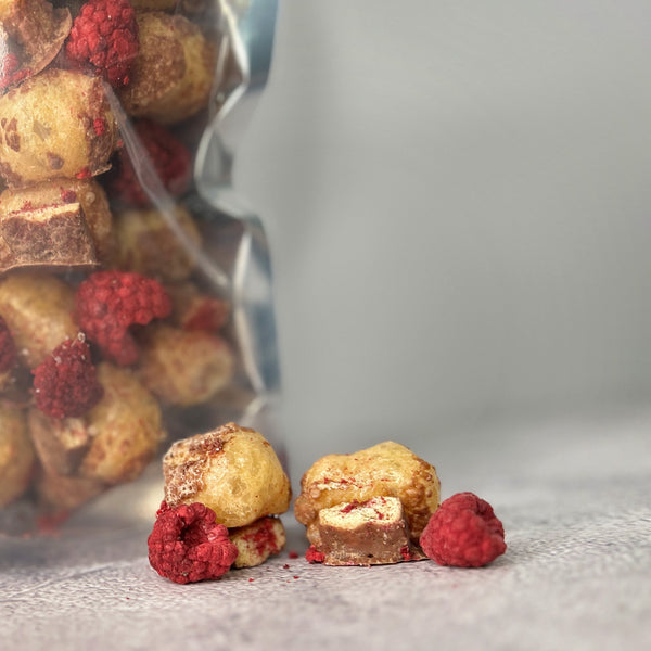 freeze-dried chocolate-cookie bars with a caramel puff and freeze-dried raspberries.